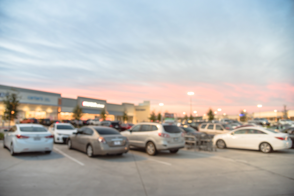 busy parking lot at strip mall